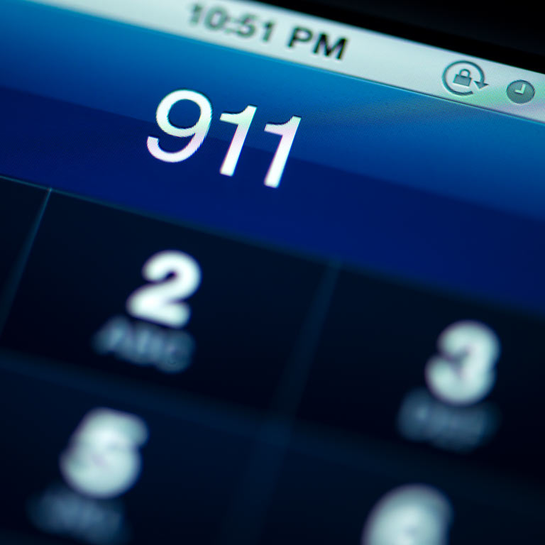 a smartphone screen with the numbers 911